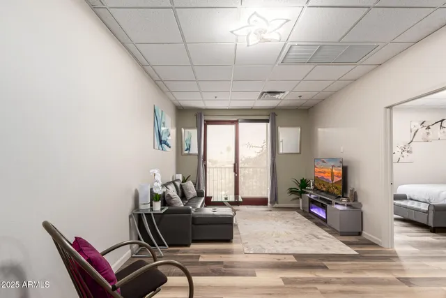a living room with furniture and a flat screen tv