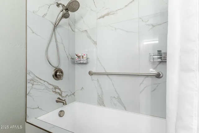 a bathroom with a sink and mirror