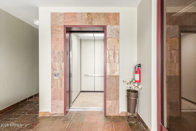 a room with cabinet and a white door