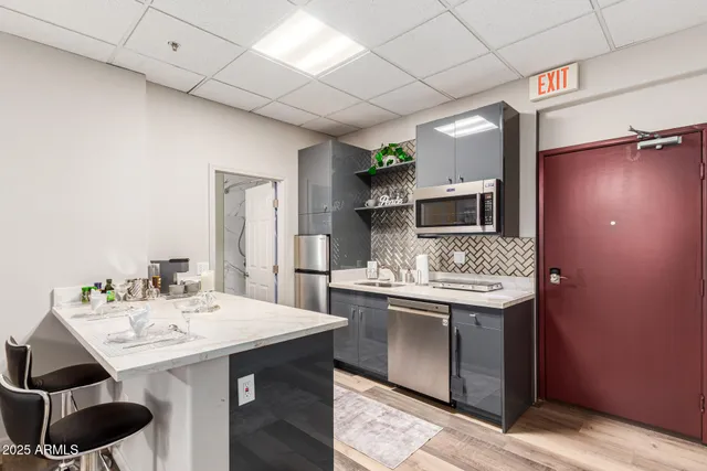 a kitchen with a sink and cabinets