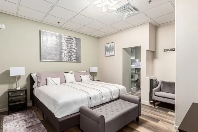 a bedroom with a bed and a couch