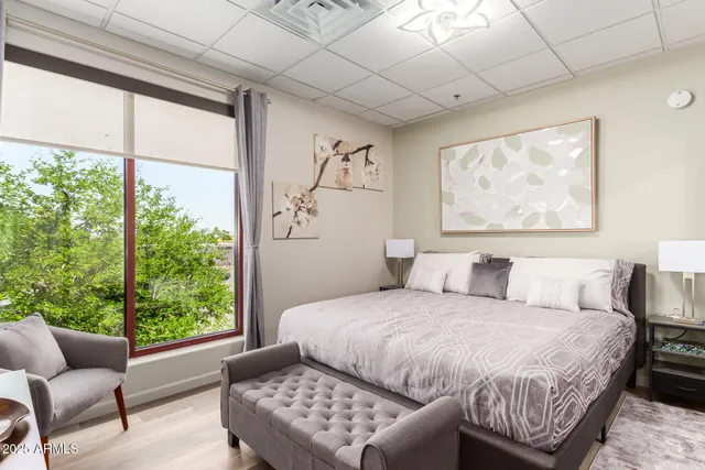 a bedroom with a bed and a couch