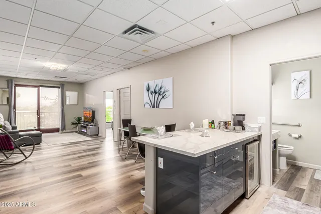 a room with a wooden floor and furniture