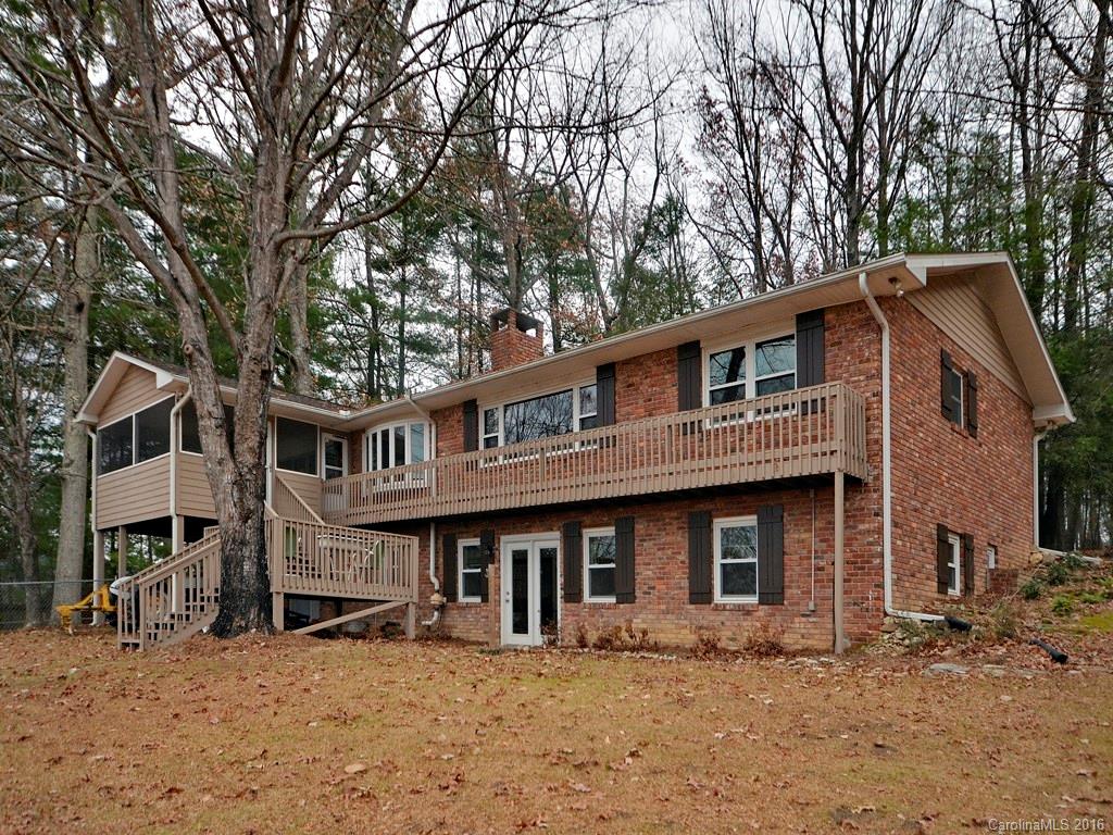 43 Cold Springs Road Hendersonville, NC 28792 - Photo 1 of 24 a front view of a building with trees