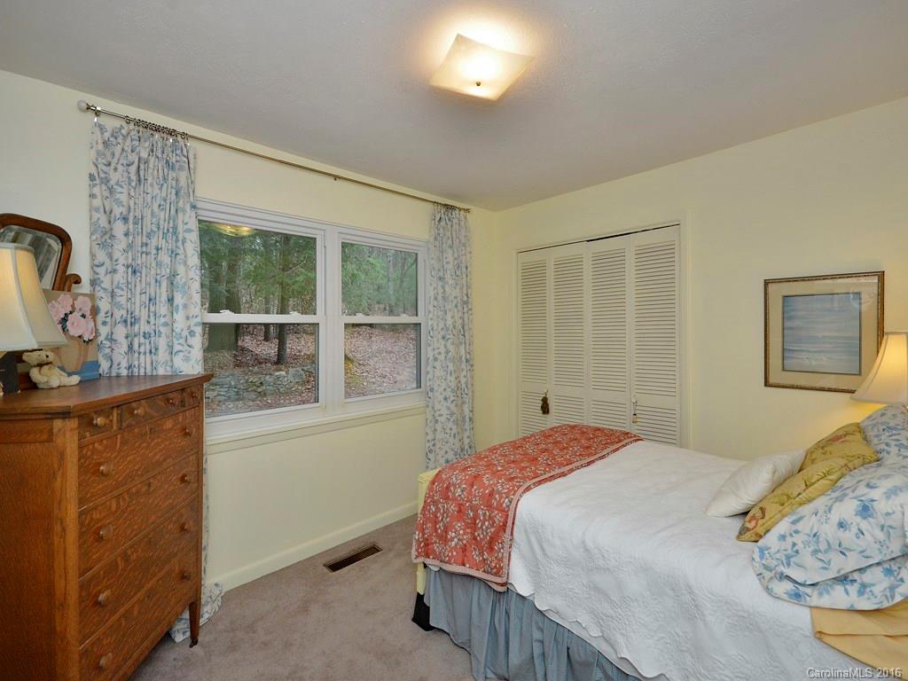 43 Cold Springs Road Hendersonville, NC 28792 - Photo 16 of 24 a bedroom with a bed and a window
