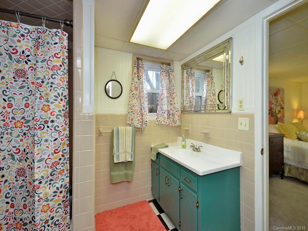 43 Cold Springs Road Hendersonville, NC 28792 - Photo 21 of 24 a bathroom with a sink mirror and shower