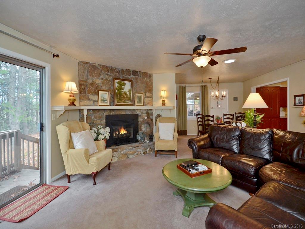 43 Cold Springs Road Hendersonville, NC 28792 - Photo 8 of 24 a living room with furniture a fireplace and a large window