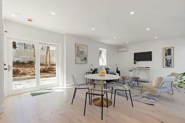 a view of a dining room with furniture window and outside view