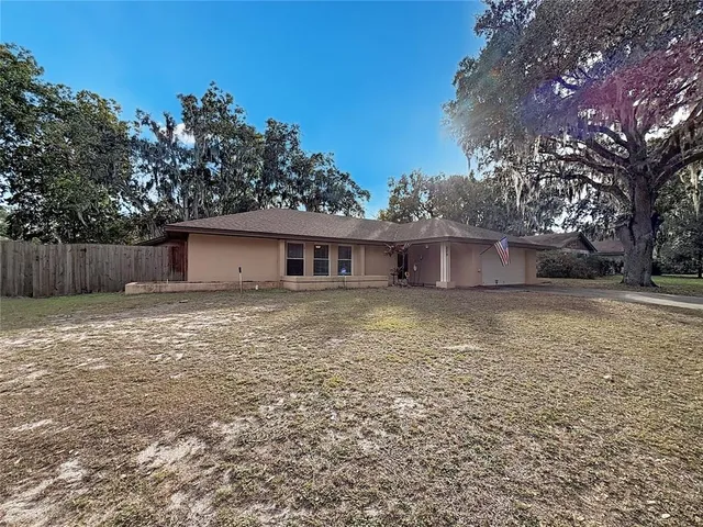 a house view with a backyard space