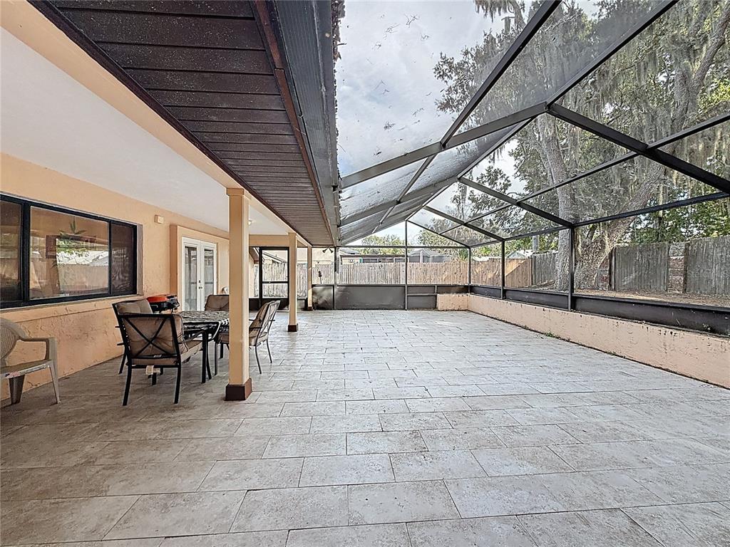 209 1st Street Tavares, FL 32778 - Photo 14 of 19 a view of a patio with table and chairs