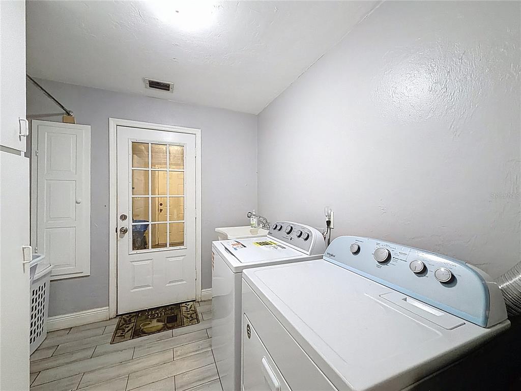 209 1st Street Tavares, FL 32778 - Photo 15 of 21 a utility room with dryer and washer