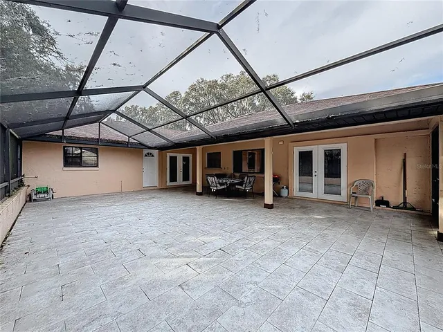 a view of a house with a backyard