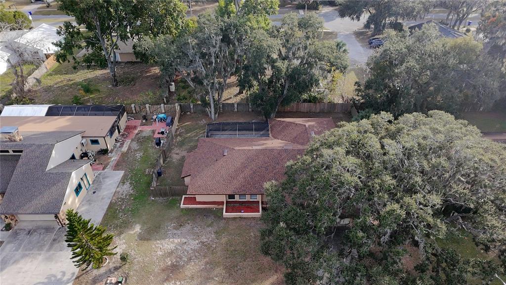 209 1st Street Tavares, FL 32778 - Photo 17 of 19 an aerial view of a house with a yard