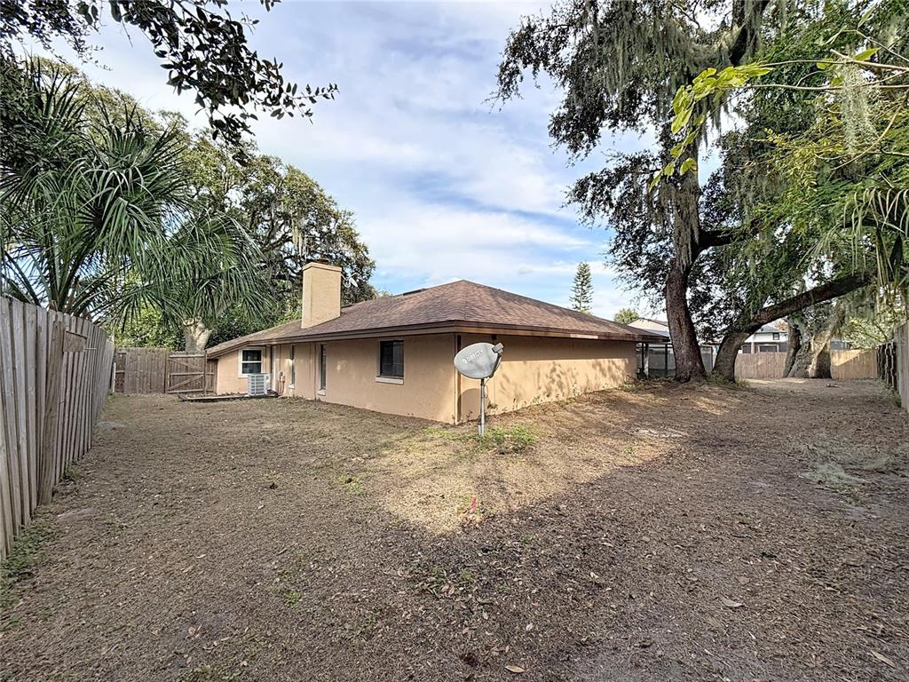 209 1st Street Tavares, FL 32778 - Photo 18 of 21 a view of a house with a yard