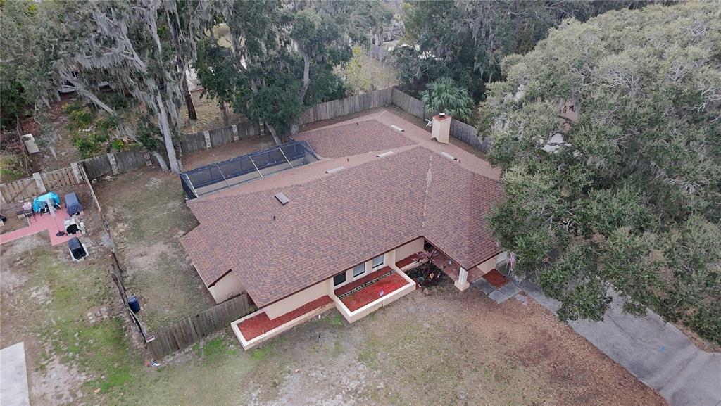 209 1st Street Tavares, FL 32778 - Photo 19 of 19 an aerial view of a house with a yard and lake