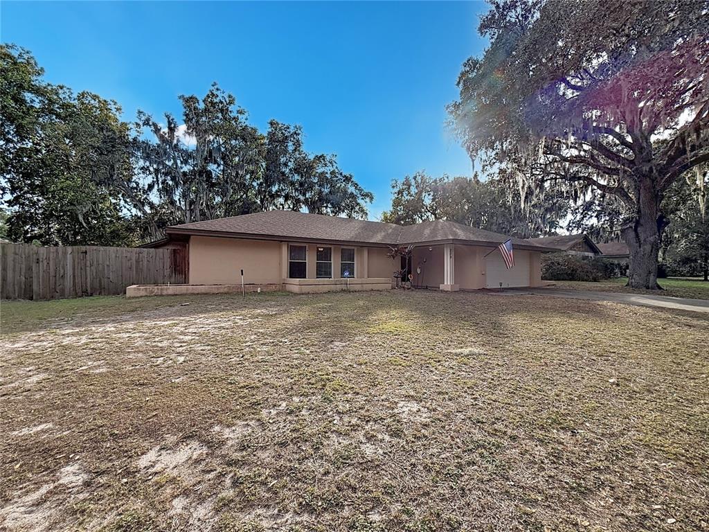 209 1st Street Tavares, FL 32778 - Photo 2 of 21 a house view with a backyard space