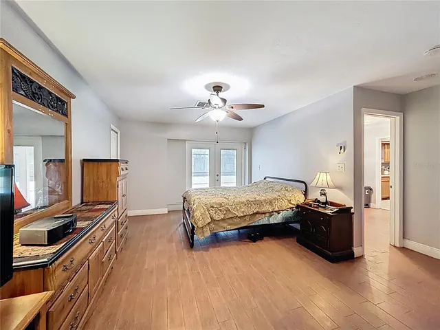 a bedroom with a bed and dresser