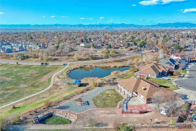 an aerial view of a house with a ocean view