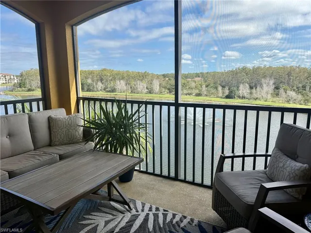a balcony with furniture and a swing
