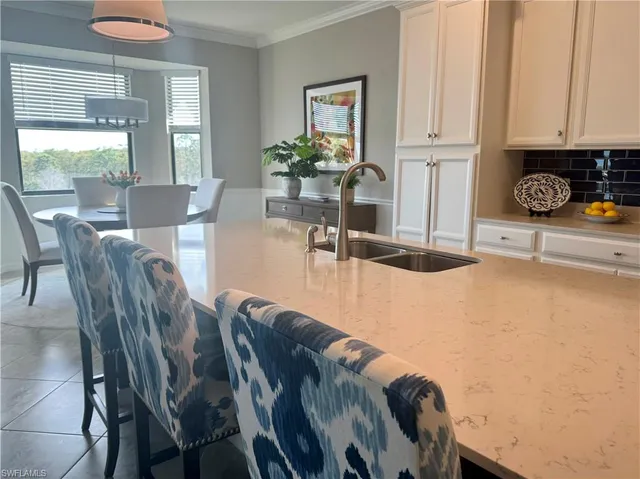 a view of a dining room with furniture and window