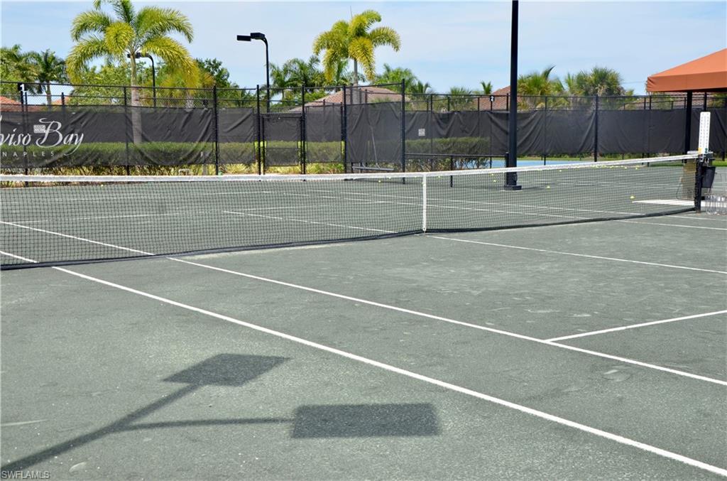 9584 Trevi Court, Unit 5242 Naples, FL 34113 - Photo 41 of 50 a view of a tennis court