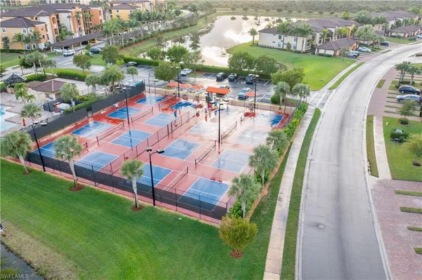an aerial view of a swimming pool with outdoor space and lake view
