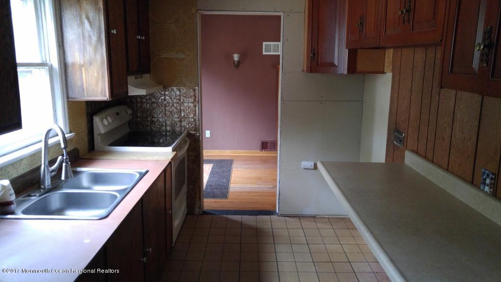 222 Newman Springs Road Red Bank, NJ 07701 - Photo 4 of 12 a kitchen with a sink stove and cabinets