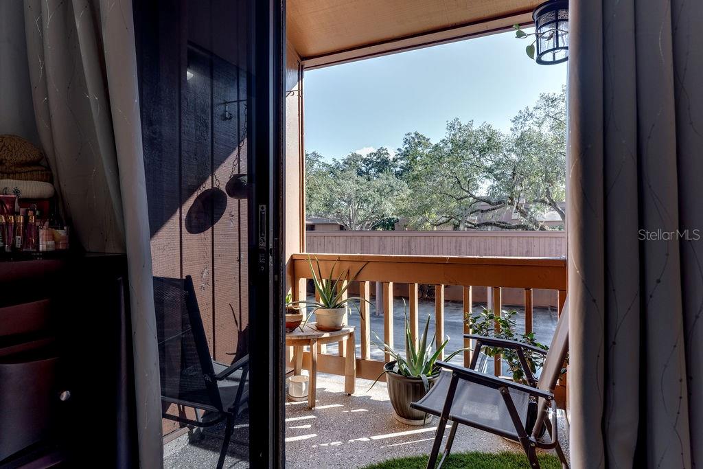970 East Michigan Street, Unit B Orlando, FL 32806 - Photo 15 of 24 a view of a porch with a table and chairs