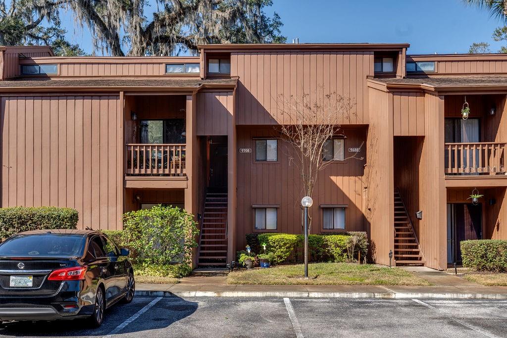970 East Michigan Street, Unit B Orlando, FL 32806 - Photo 24 of 24 a front view of a house with a garden and parking