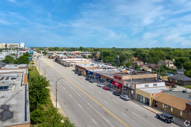 a kitchen with stainless steel appliances wooden cabinets a stove top oven a sink and dishwasher