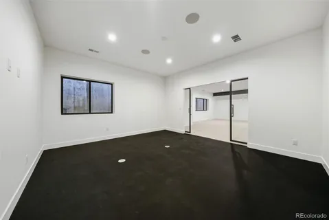 a bathroom with a double vanity sink and mirror