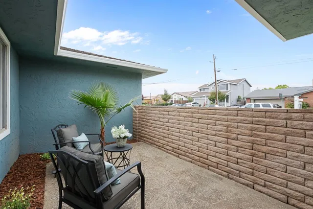 a view of a balcony with chairs
