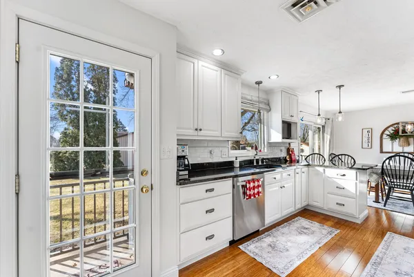 a kitchen with stainless steel appliances granite countertop a stove and a sink