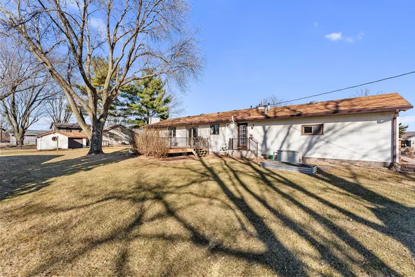 a view of a yard with basketball court