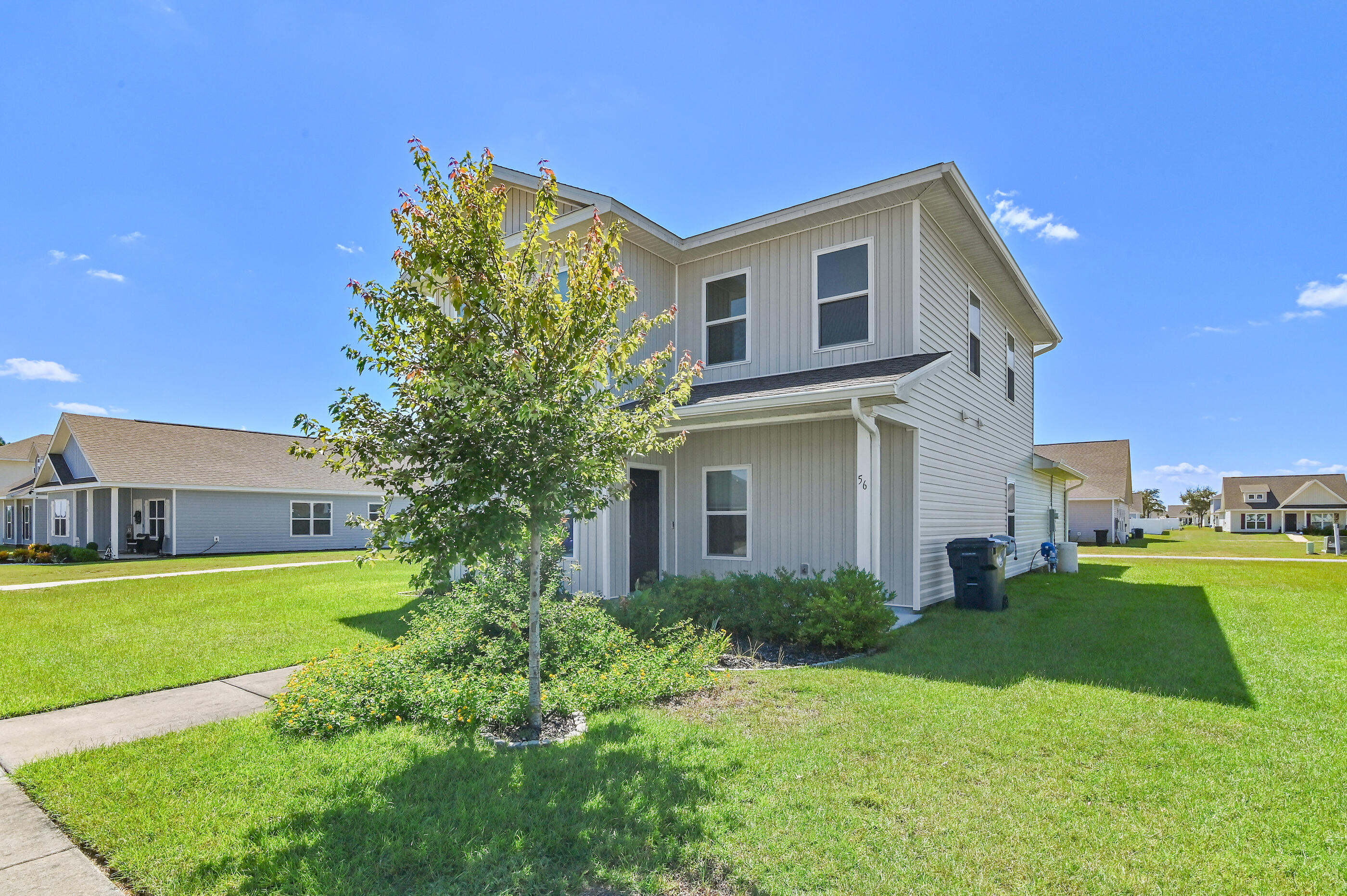 56 Silverthorn Street Freeport, FL 32439 - Photo 30 of 31 a front view of a house with a yard