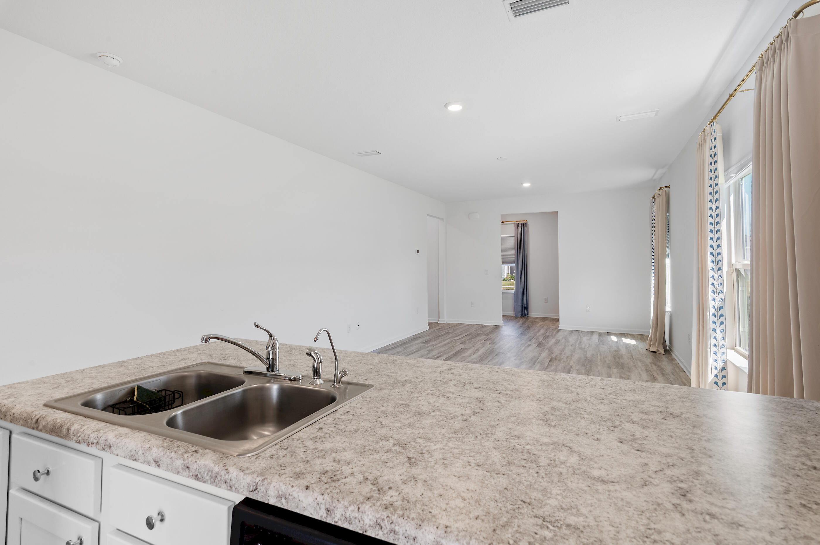 56 Silverthorn Street Freeport, FL 32439 - Photo 8 of 31 a view of a kitchen with a sink and cabinets