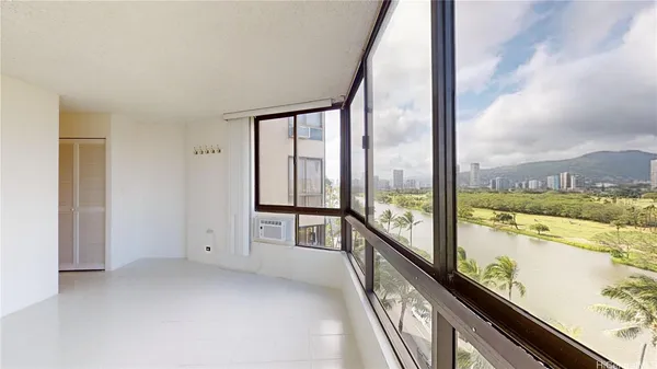wooden floor in an empty room with outdoor view
