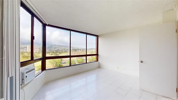 a view of an empty room with a large window