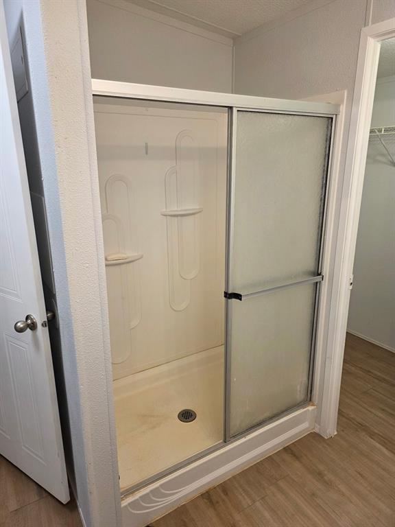115 Yates Circle Aledo, TX 76008 - Photo 26 of 31 a bathroom with a glass shower door
