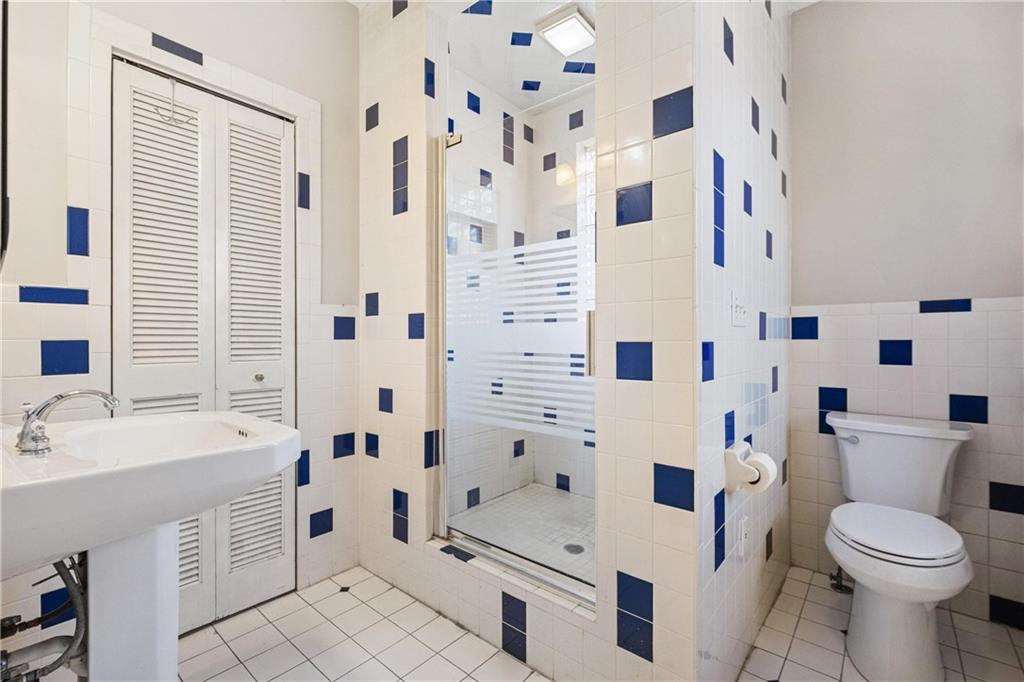 3578 Brighton Road Pittsburgh, PA 15212 - Photo 23 of 35 The upstairs bathroom offers a walk in shower.