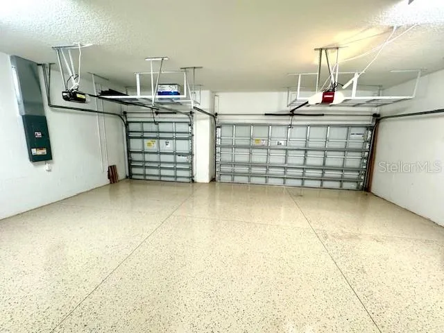 a bathroom with a sink a mirror and shower