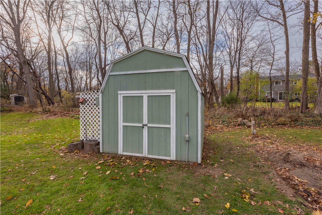 11 Fallbrook Circle Penfield, NY 14625 - Photo 46 of 49 SHED HAS EXTERIOR ELECTRIC AND ELECTRIC POLE IN GR