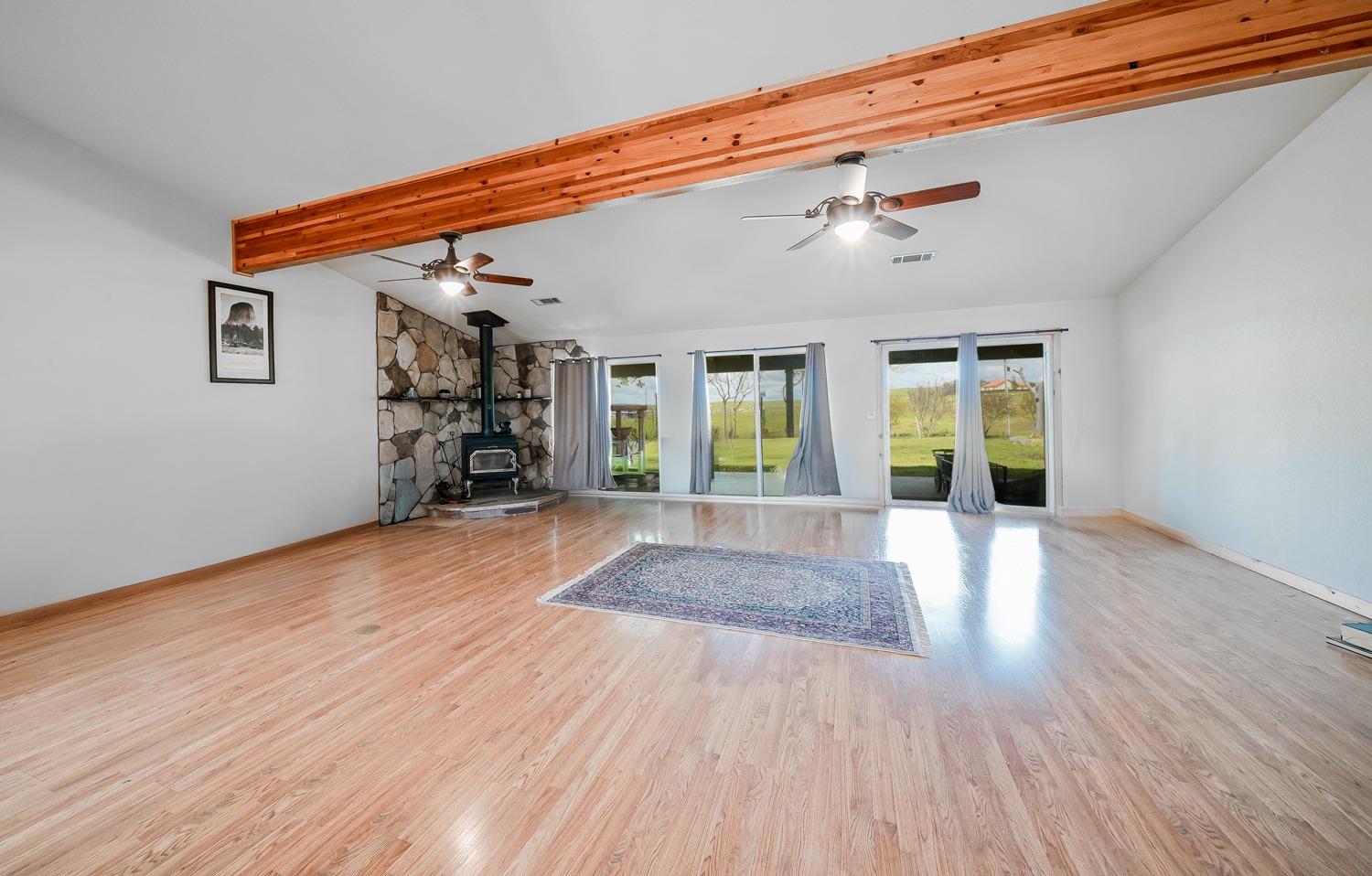 37491 Verde Avenue Madera, CA 93636 - Photo 13 of 66 a view of a livingroom with wooden floor