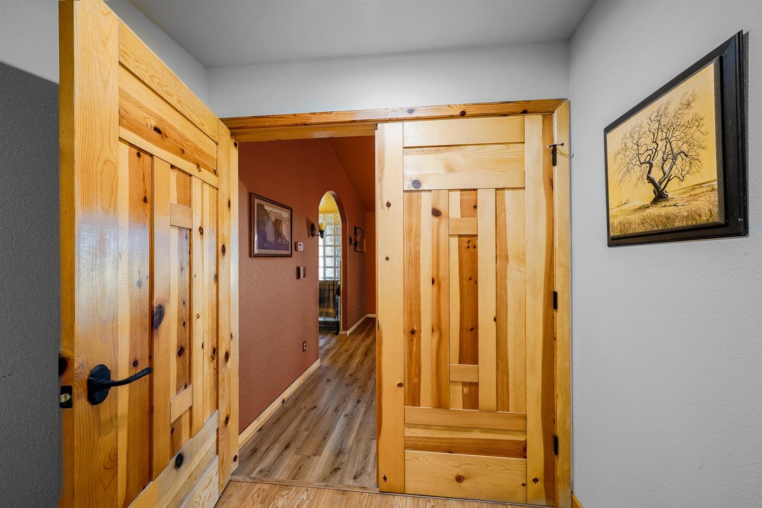 37491 Verde Avenue Madera, CA 93636 - Photo 17 of 66 a view of a hallway with wooden floor and staircase