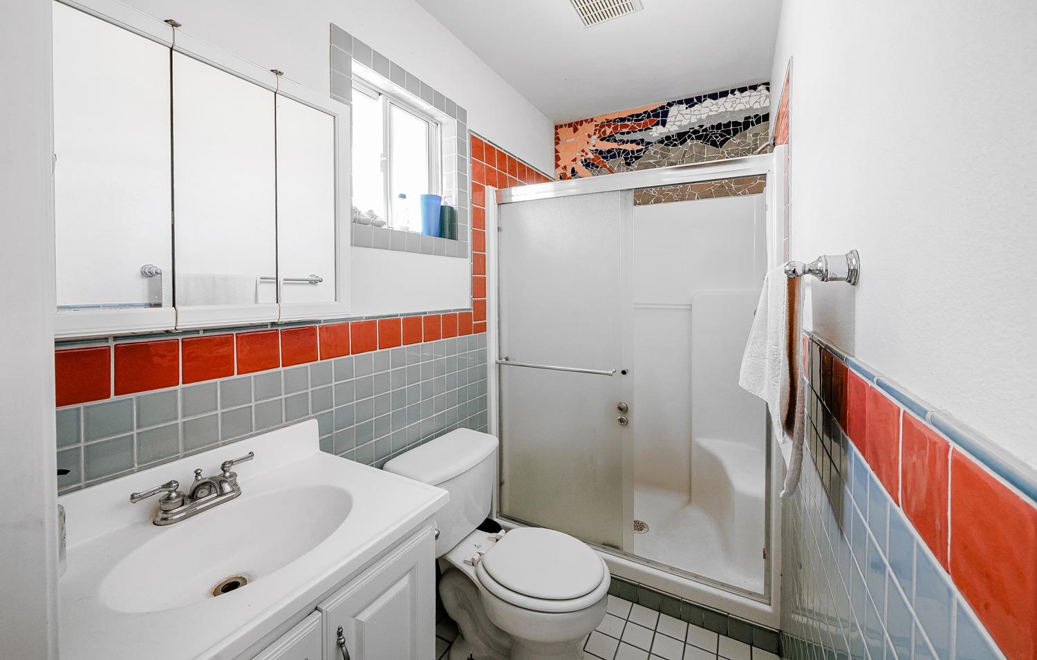 37491 Verde Avenue Madera, CA 93636 - Photo 21 of 66 a bathroom with a sink a toilet and shower