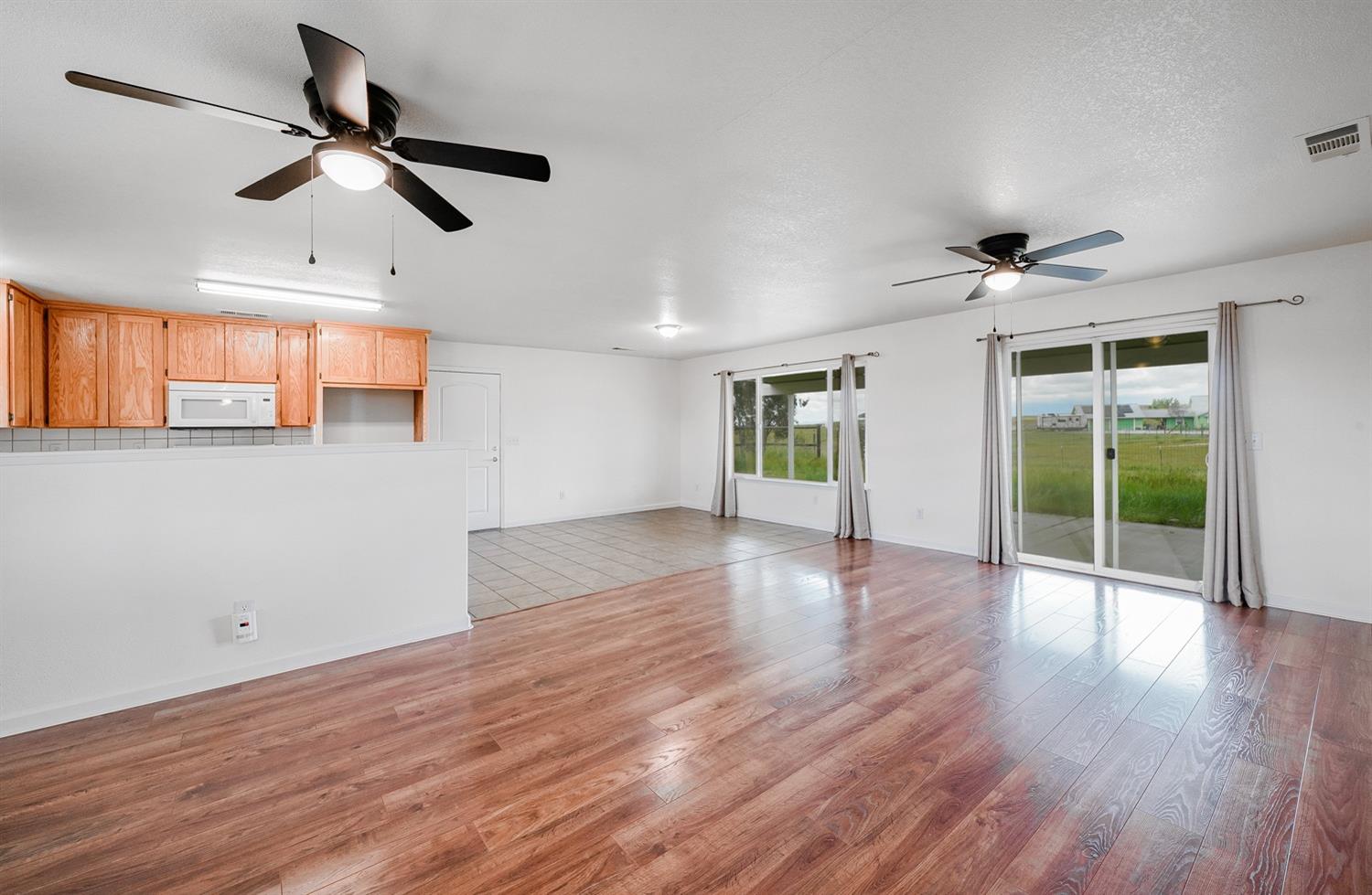 37491 Verde Avenue Madera, CA 93636 - Photo 37 of 66 a view of empty room with wooden floor and fan
