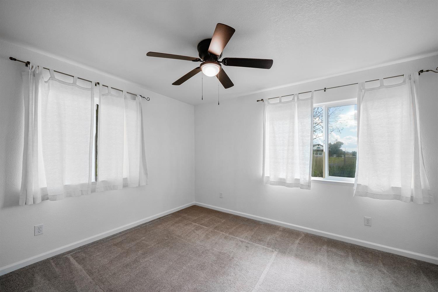 37491 Verde Avenue Madera, CA 93636 - Photo 42 of 66 a view of an empty room with a window