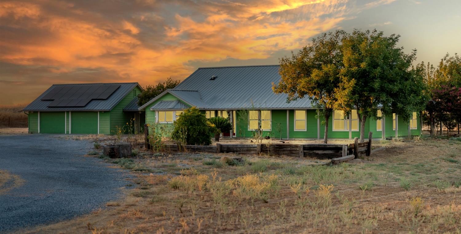 37491 Verde Avenue Madera, CA 93636 - Photo 57 of 66 a view of a house with a patio and a fire pit