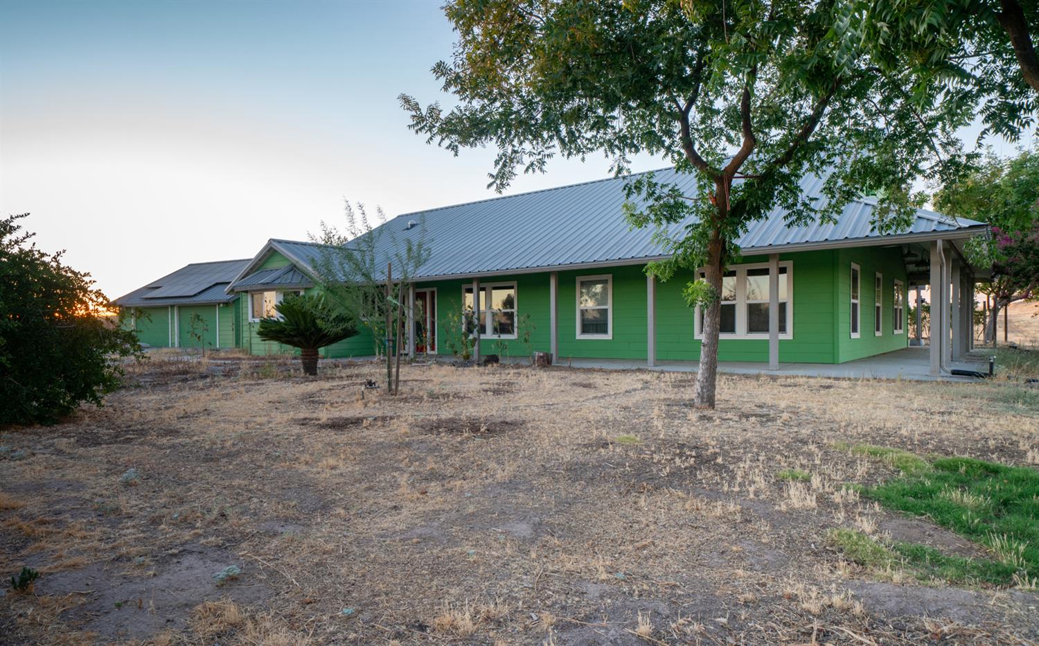 37491 Verde Avenue Madera, CA 93636 - Photo 62 of 66 a house with trees in front of it