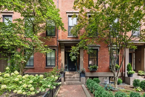 front view of a house with a small yard